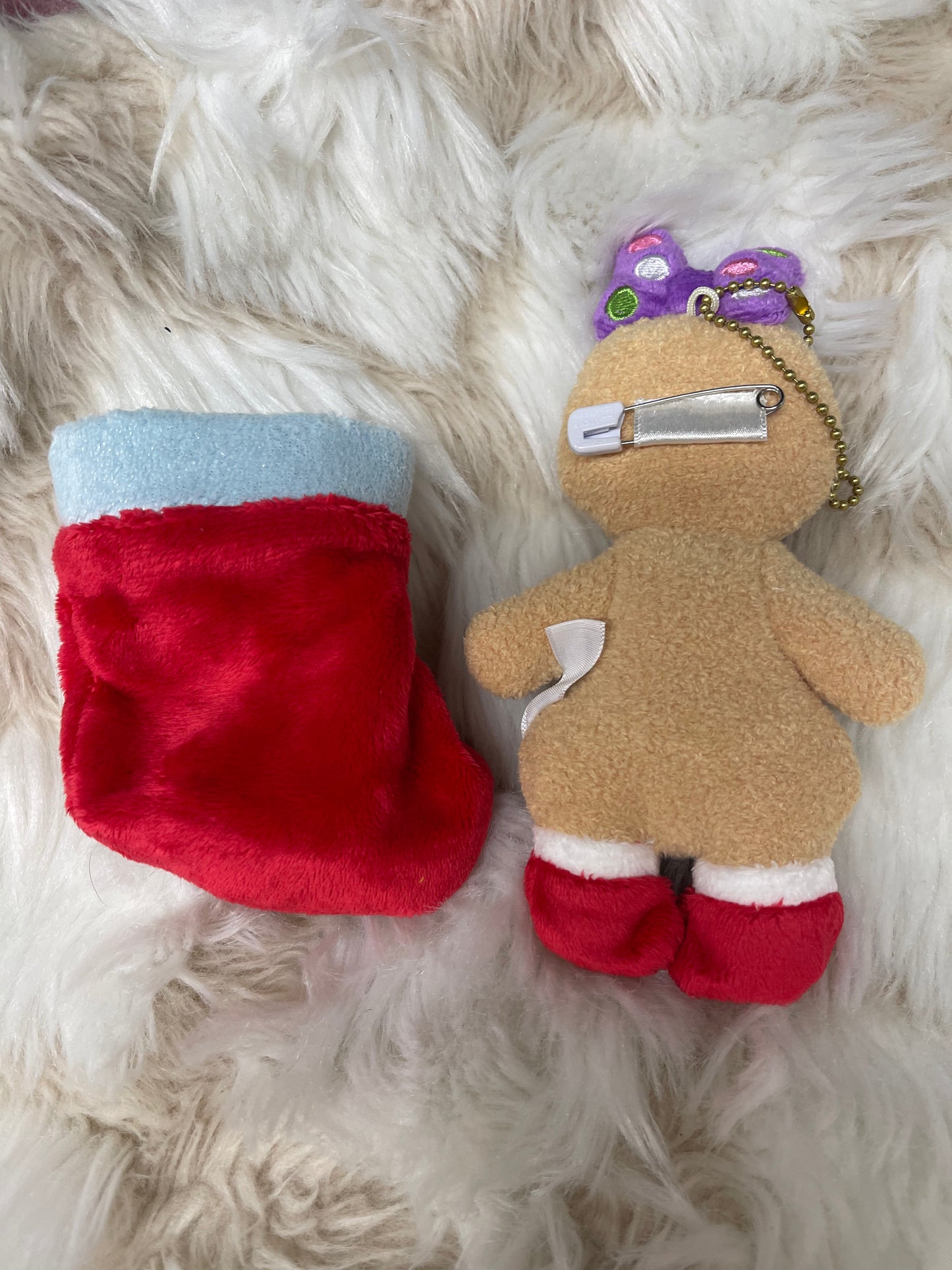 Preowned Tokyo Disney daisy suck gingerbread Christmas keychain badge and stocking
