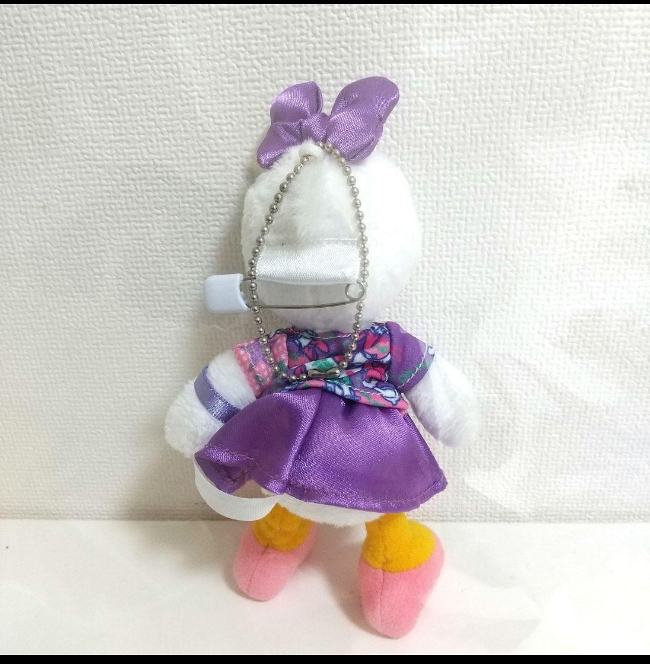 Tokyo Disney park goer Daisy Duck keychain plush badge